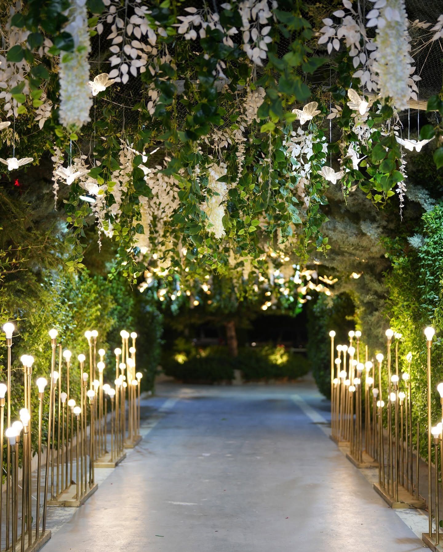 A candle-lit wedding entrance at Al Maram